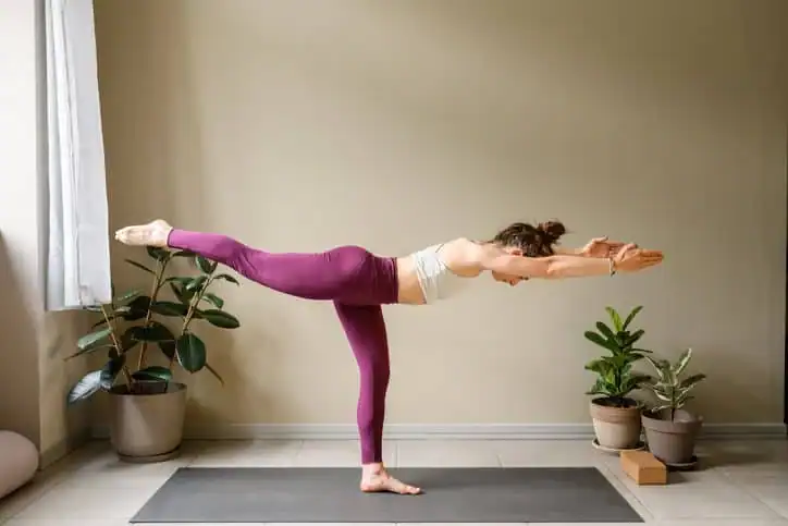 Achieving the Perfect Tone: How Often Should You Exercise for Results? 1 Woman doing Yoga exercise Shepperton Green to help with toning the body.