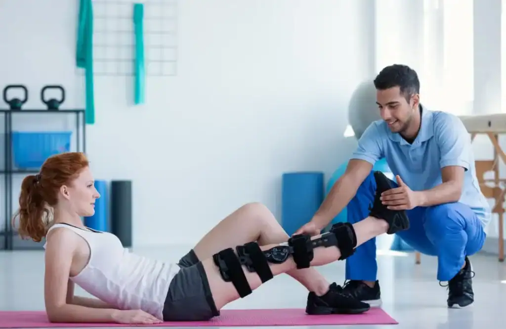 Woman having treatment to help muscle recovery Shepperton Green after an injury