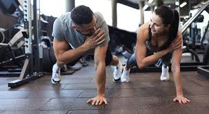 Sculpting Sleek Arms: The Essential Role of Cardio in Toning Without Bulking Up 1 Image of man and woman doing Cardio Shepperton Green to tone their arms.